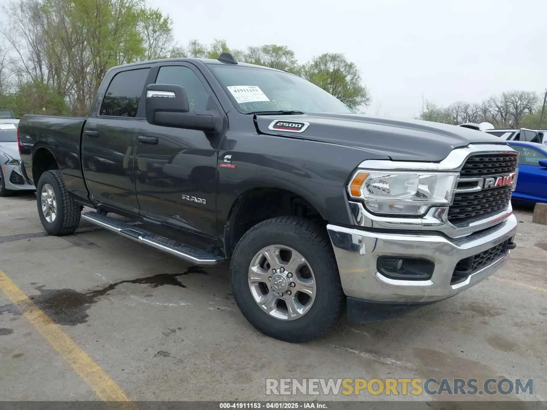 1 Photograph of a damaged car 3C6UR5DL8PG611061 RAM 2500 2023