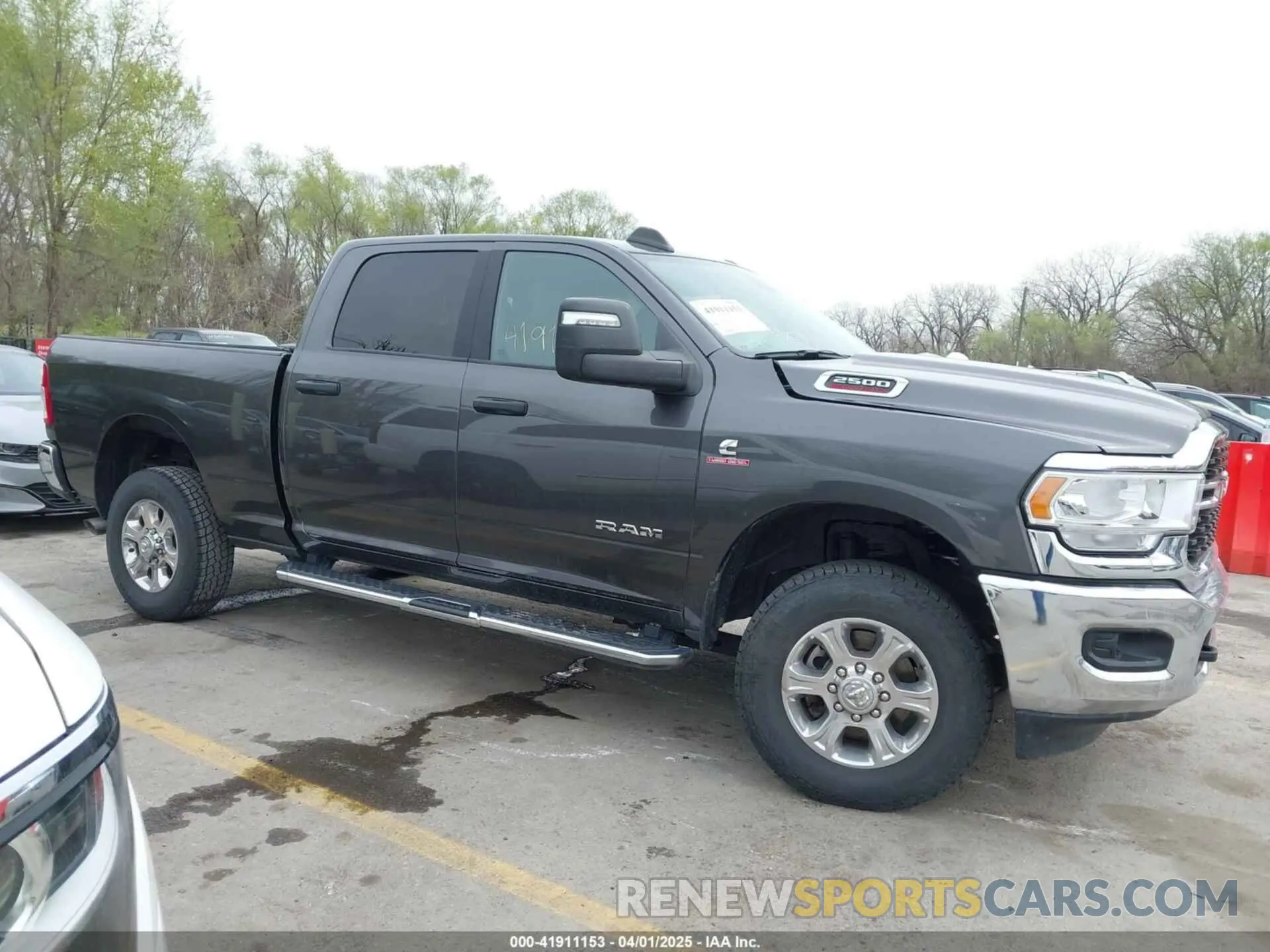 12 Photograph of a damaged car 3C6UR5DL8PG611061 RAM 2500 2023