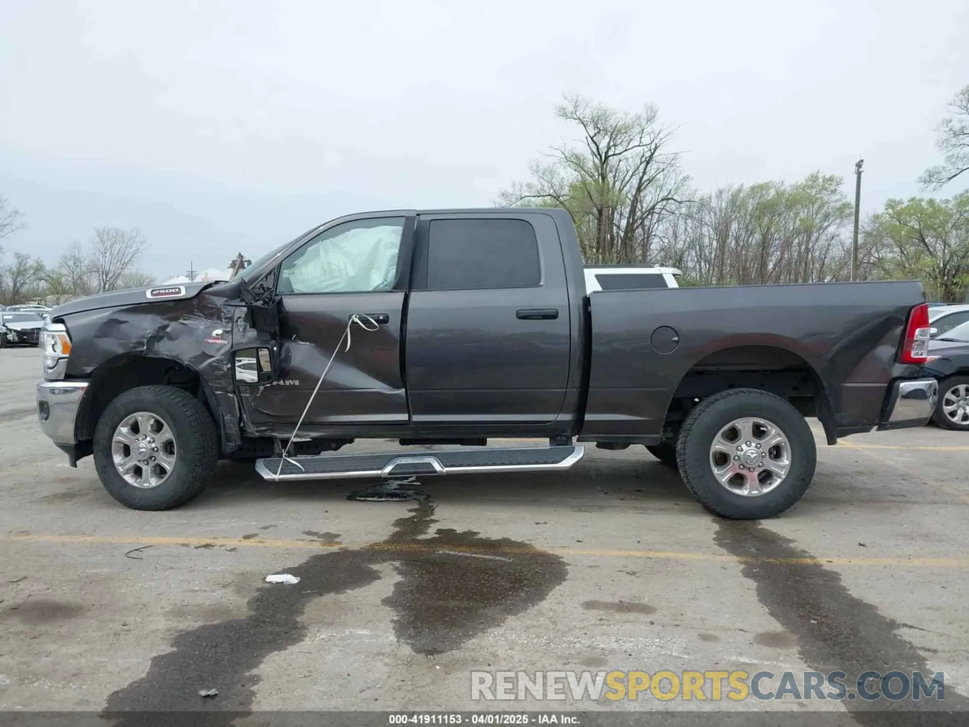13 Photograph of a damaged car 3C6UR5DL8PG611061 RAM 2500 2023