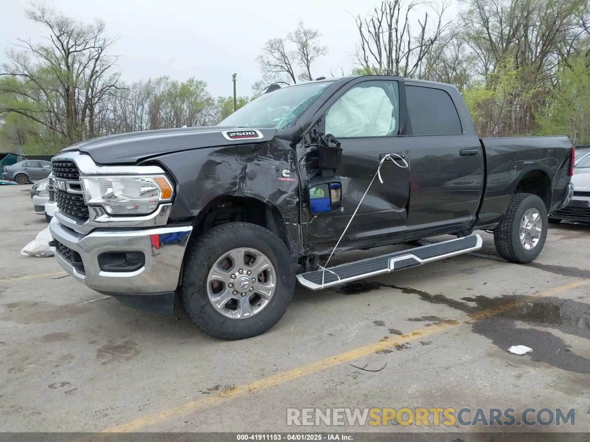 2 Photograph of a damaged car 3C6UR5DL8PG611061 RAM 2500 2023