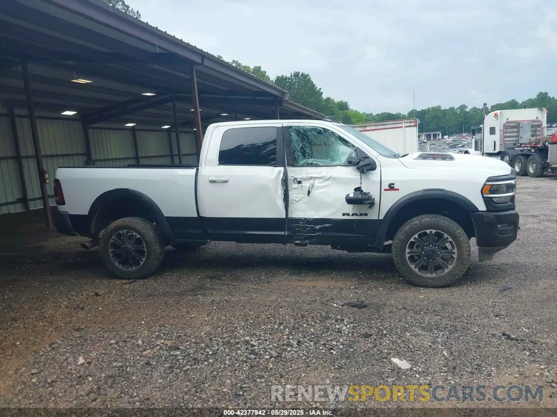 13 Photograph of a damaged car 3C6UR5EL0PG568608 RAM 2500 2023