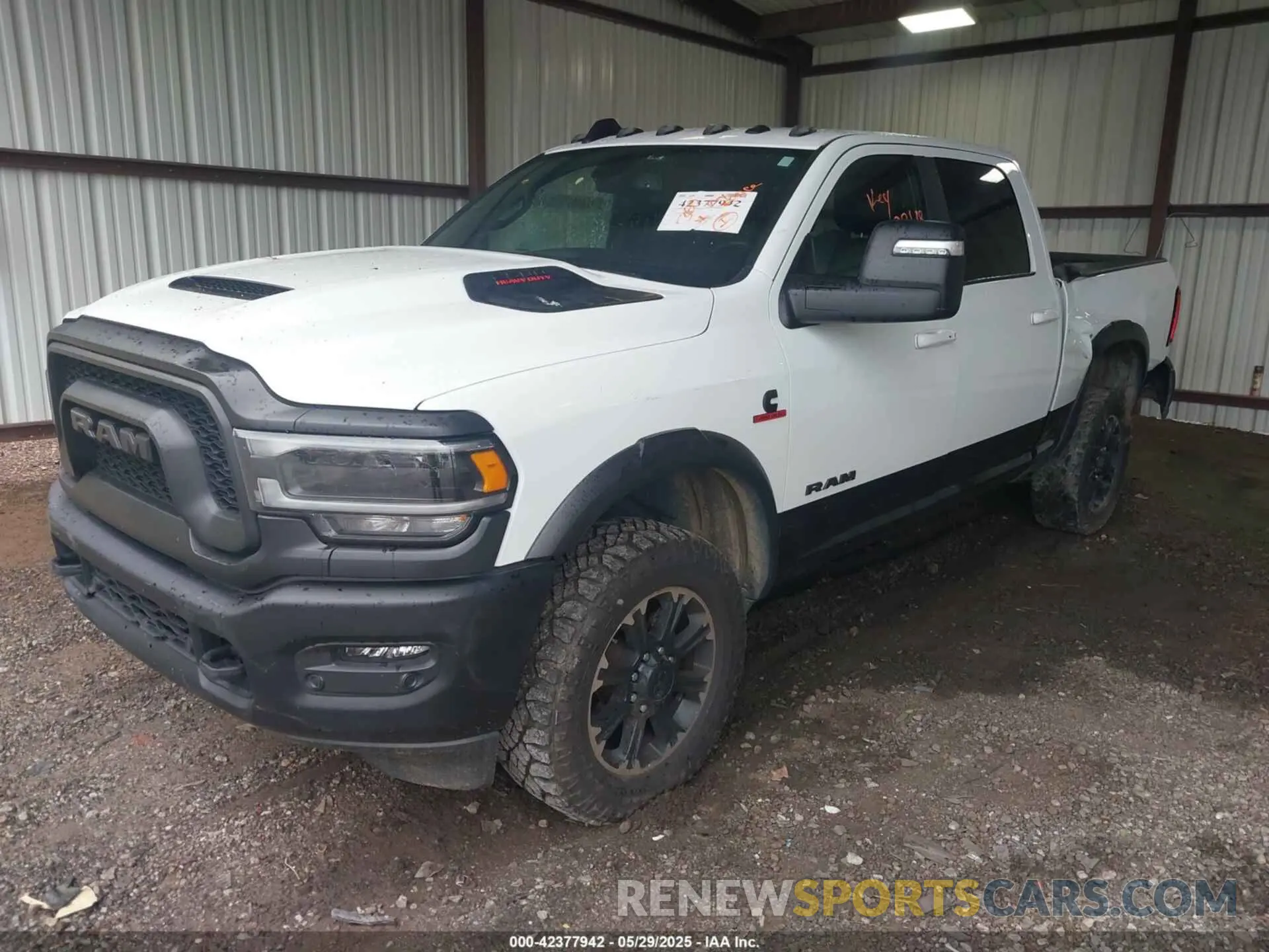 2 Photograph of a damaged car 3C6UR5EL0PG568608 RAM 2500 2023
