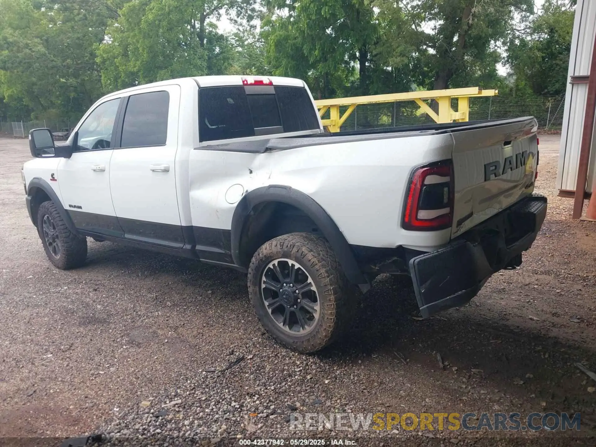 3 Photograph of a damaged car 3C6UR5EL0PG568608 RAM 2500 2023