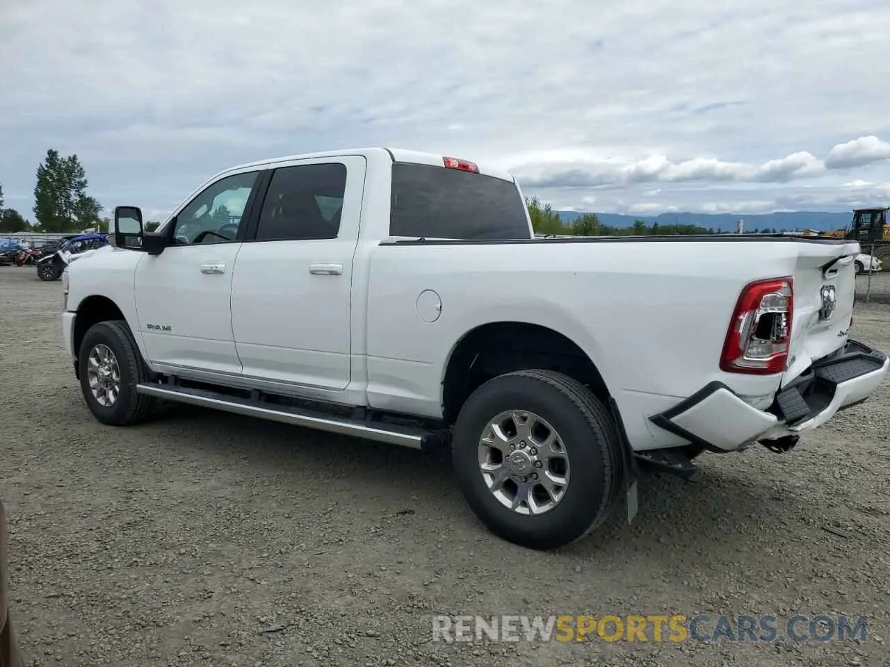 2 Photograph of a damaged car 3C6UR5FJ1PG634158 RAM 2500 2023