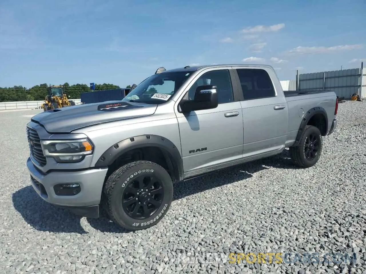 1 Photograph of a damaged car 3C6UR5FJXPG614328 RAM 2500 2023