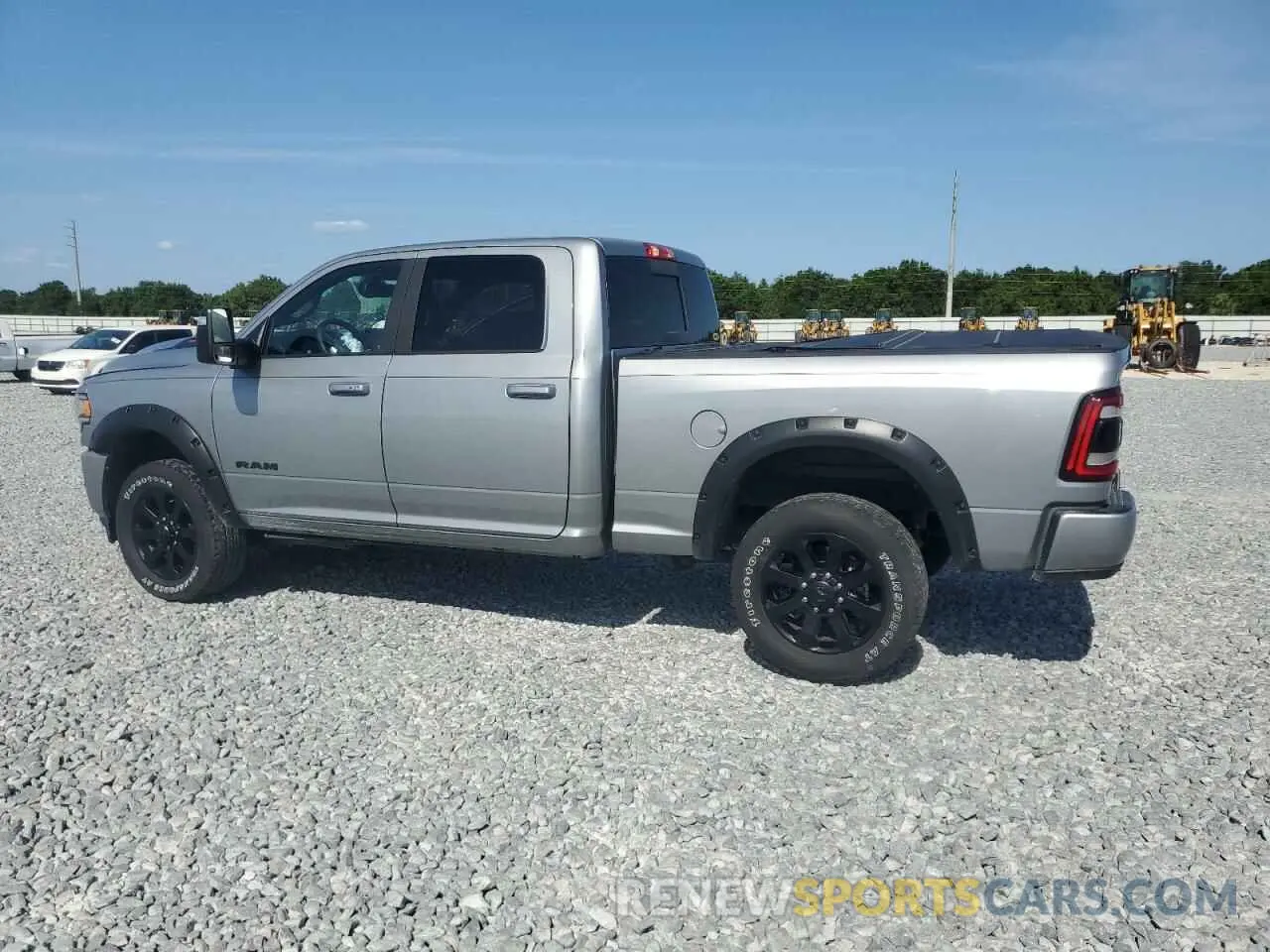 2 Photograph of a damaged car 3C6UR5FJXPG614328 RAM 2500 2023