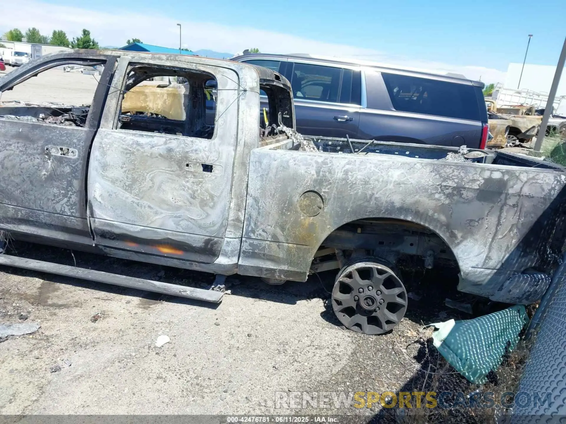 3 Photograph of a damaged car 3C6UR5FL2PG538072 RAM 2500 2023