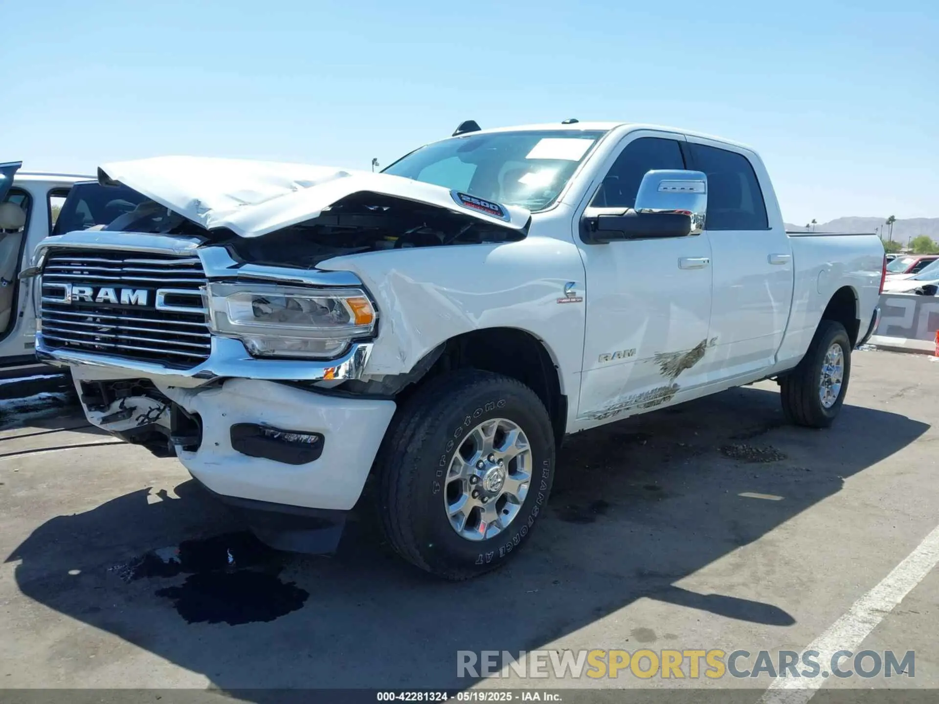 2 Photograph of a damaged car 3C6UR5FL2PG559276 RAM 2500 2023