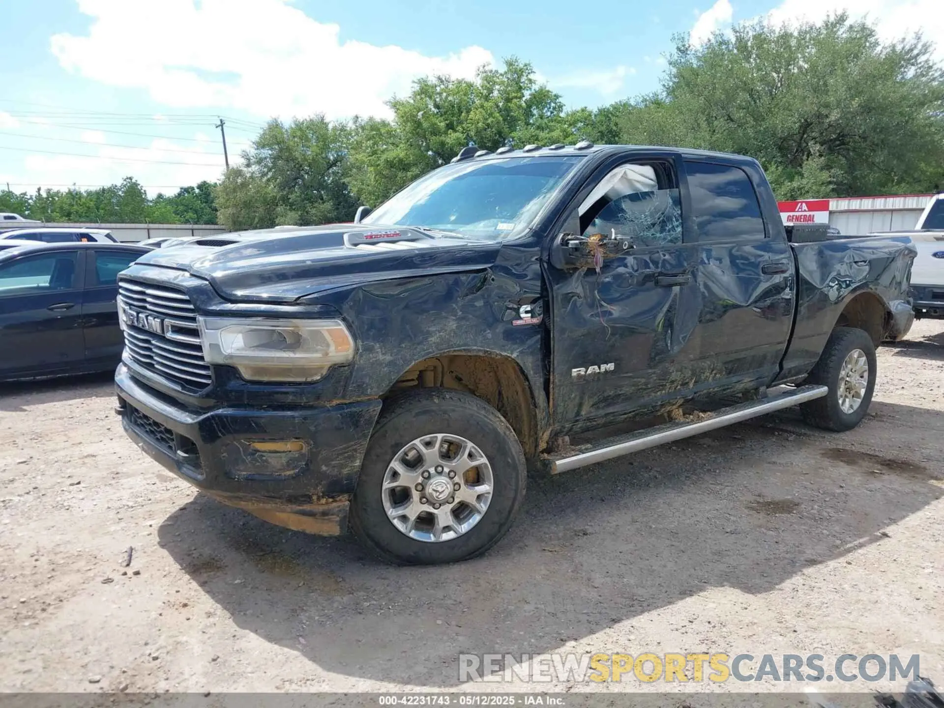 2 Photograph of a damaged car 3C6UR5FL2PG567670 RAM 2500 2023
