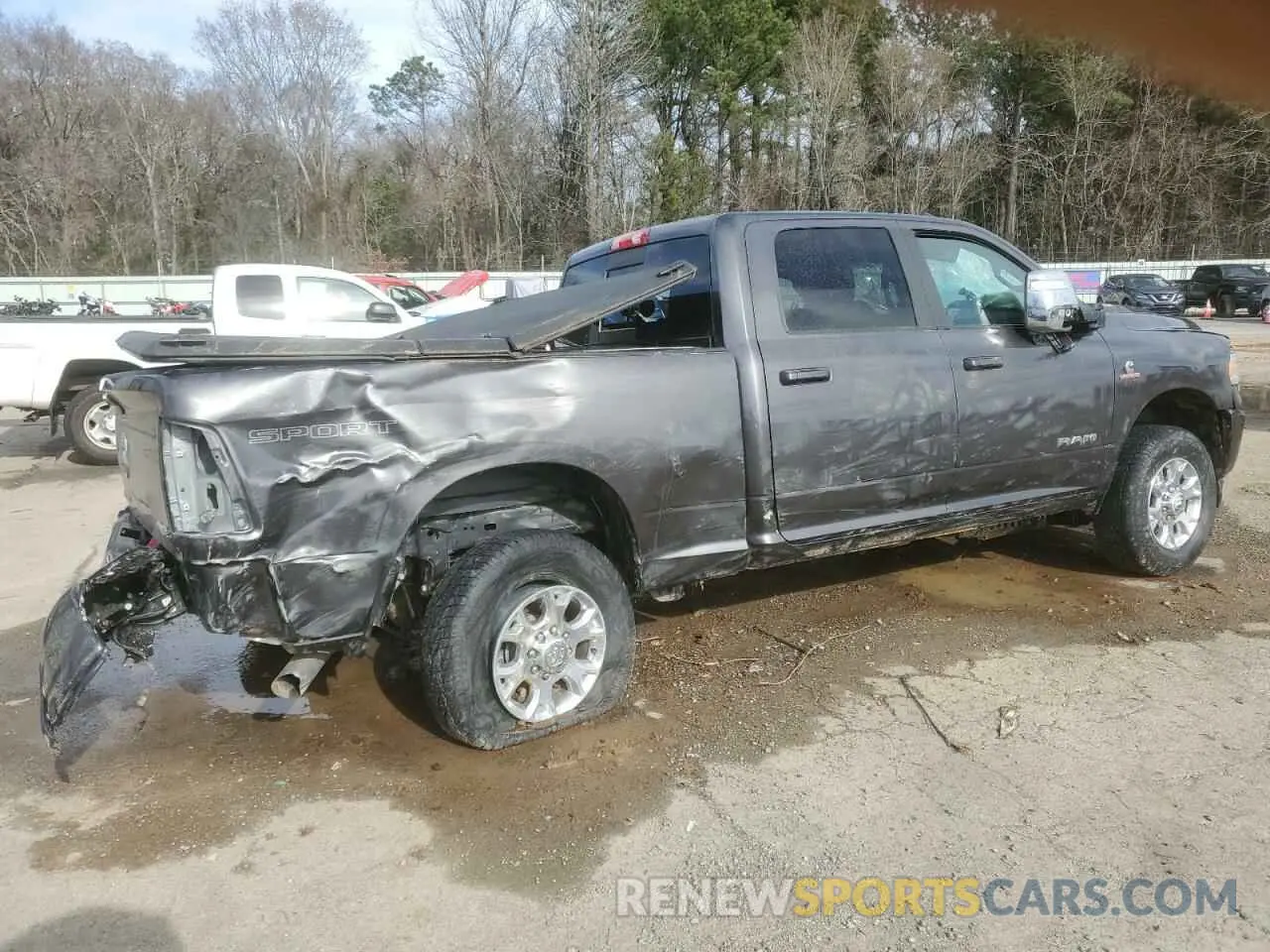 3 Photograph of a damaged car 3C6UR5FL3PG540235 RAM 2500 2023