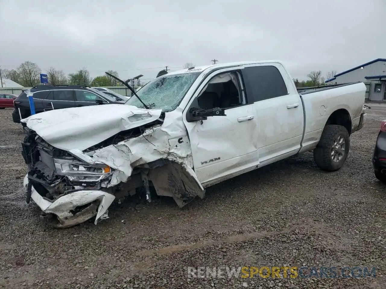 1 Photograph of a damaged car 3C6UR5FL3PG588625 RAM 2500 2023