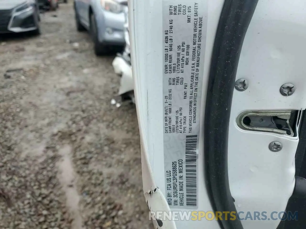 13 Photograph of a damaged car 3C6UR5FL3PG588625 RAM 2500 2023