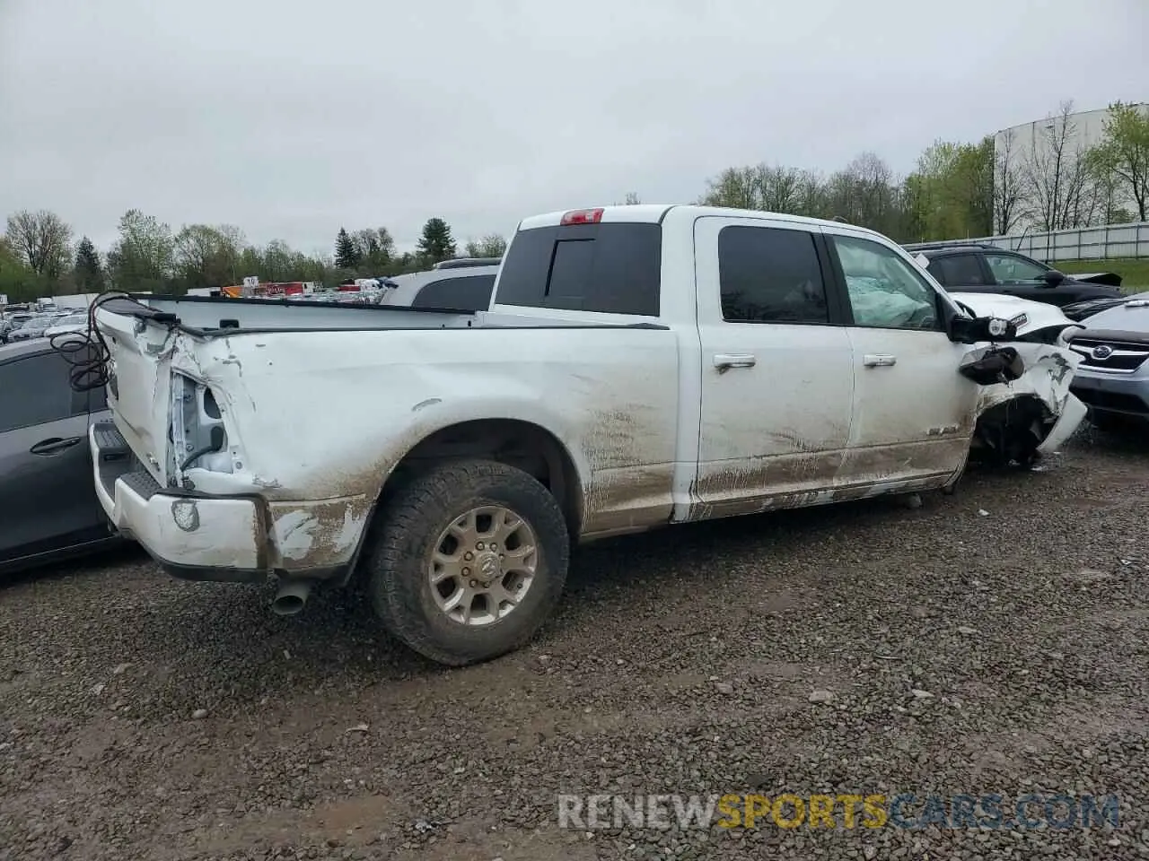 3 Photograph of a damaged car 3C6UR5FL3PG588625 RAM 2500 2023