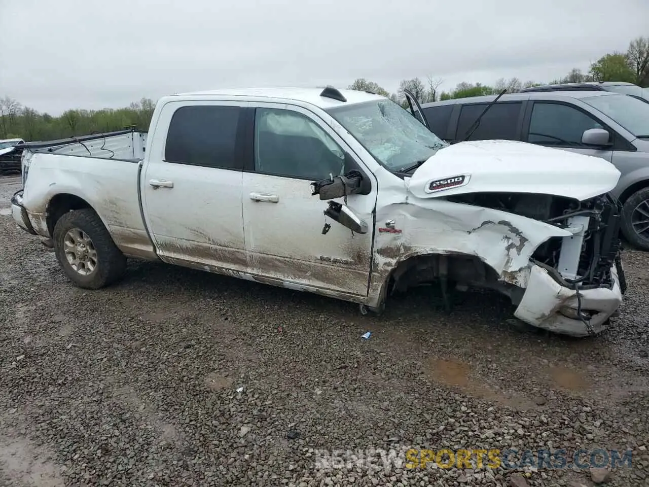 4 Photograph of a damaged car 3C6UR5FL3PG588625 RAM 2500 2023