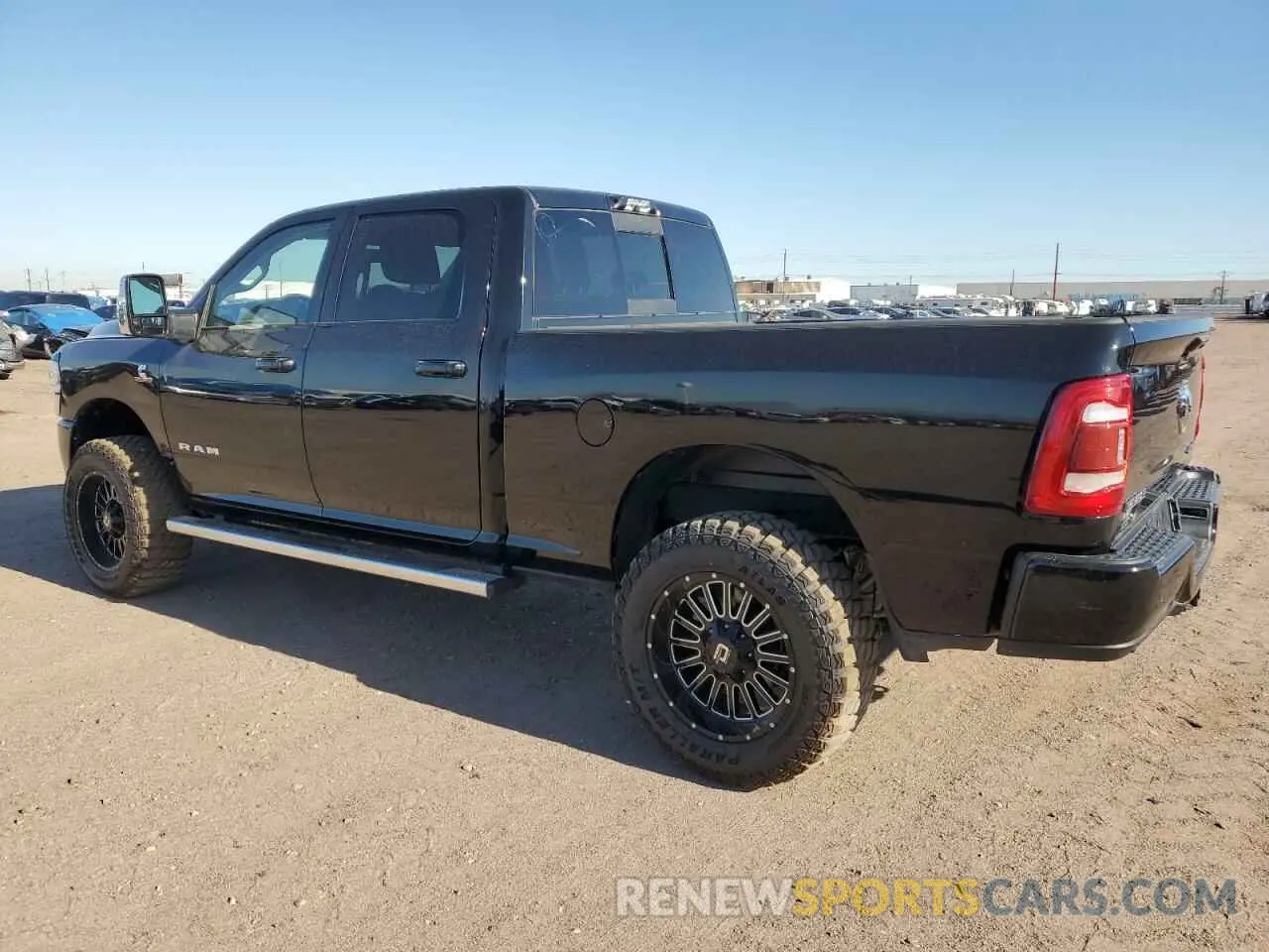 2 Photograph of a damaged car 3C6UR5FL4PG580565 RAM 2500 2023