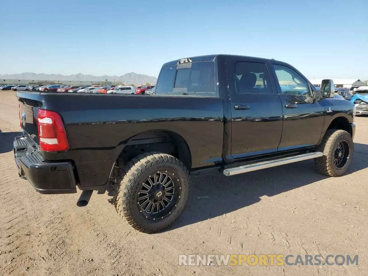 3 Photograph of a damaged car 3C6UR5FL4PG580565 RAM 2500 2023