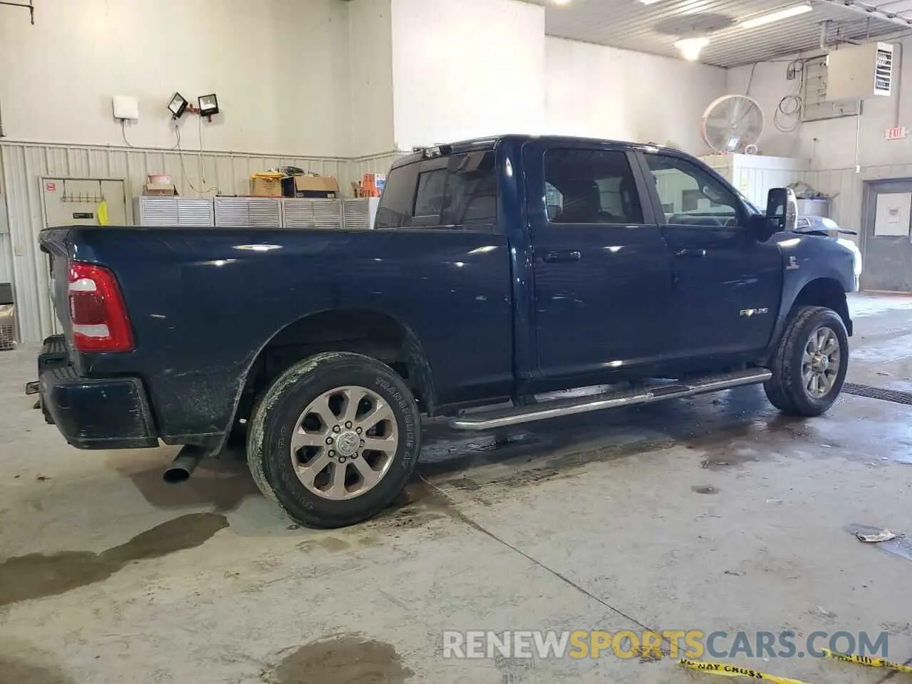 3 Photograph of a damaged car 3C6UR5FL5PG500920 RAM 2500 2023