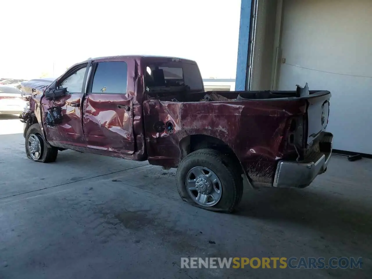 2 Photograph of a damaged car 3C6UR5FL6PG569132 RAM 2500 2023