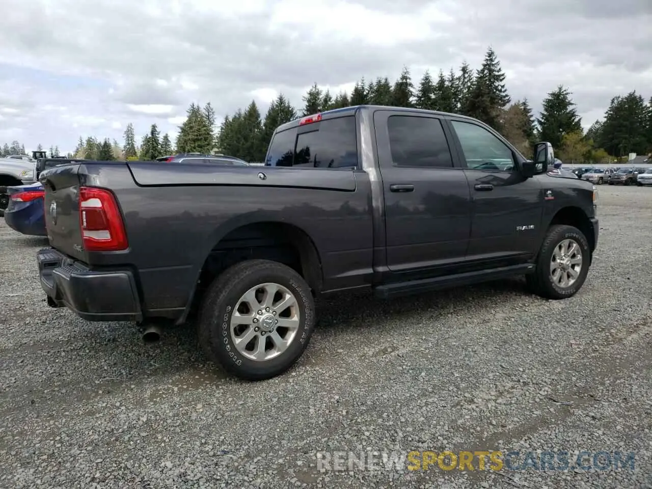 3 Photograph of a damaged car 3C6UR5FL7PG513233 RAM 2500 2023