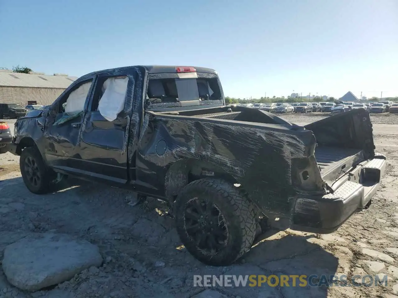 2 Photograph of a damaged car 3C6UR5FLXPG618137 RAM 2500 2023