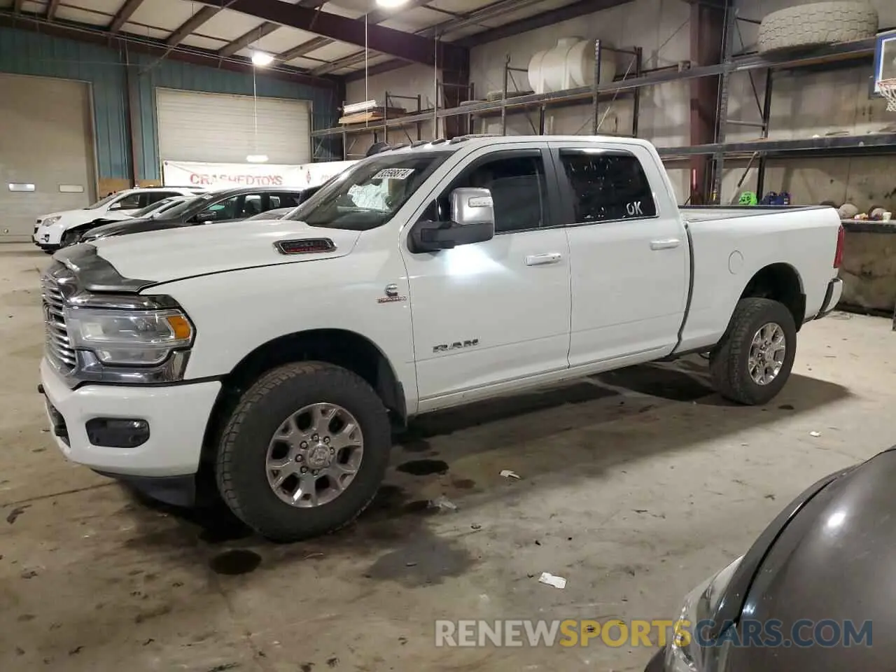 1 Photograph of a damaged car 3C6UR5FLXPG632054 RAM 2500 2023