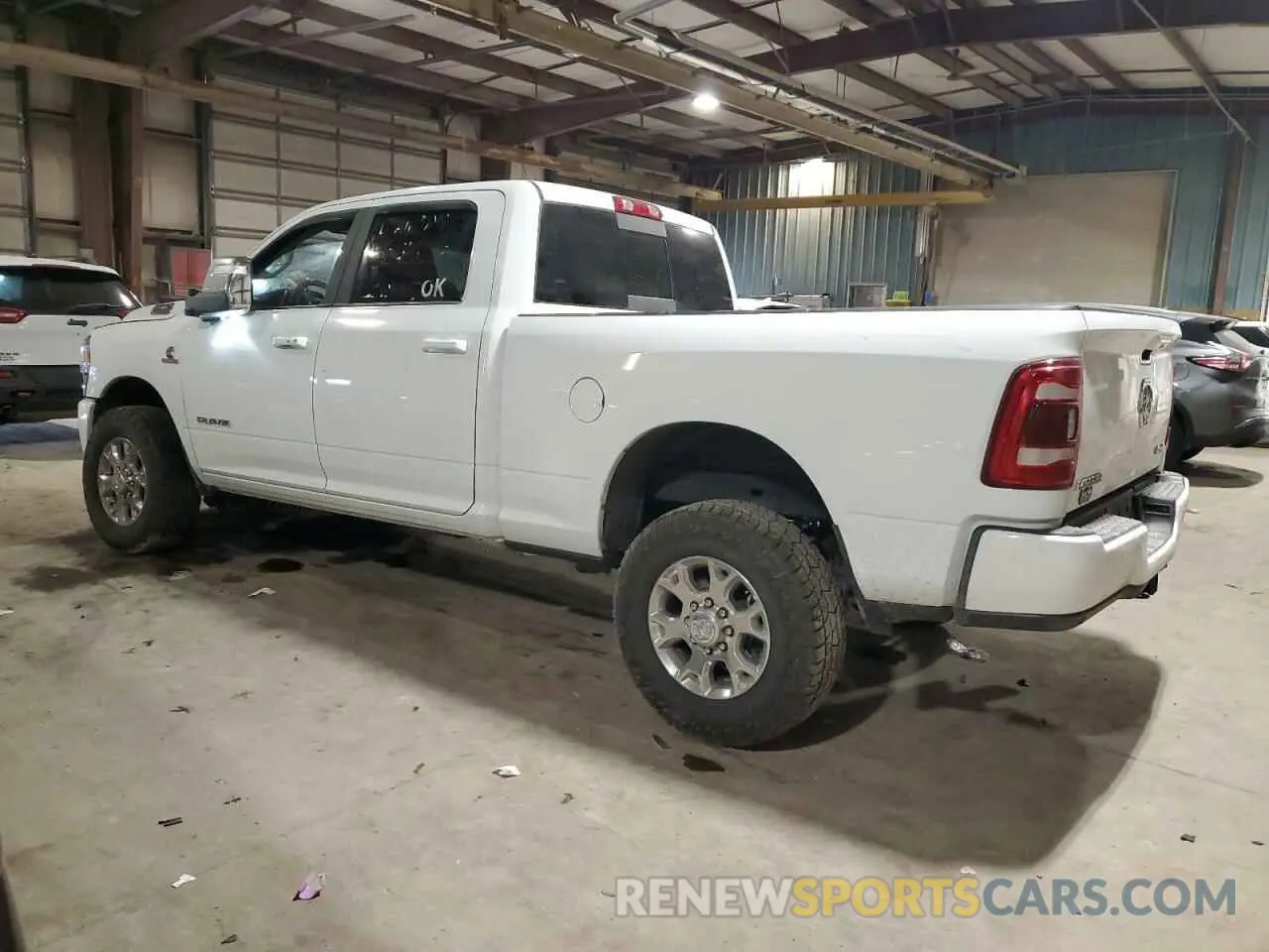 2 Photograph of a damaged car 3C6UR5FLXPG632054 RAM 2500 2023