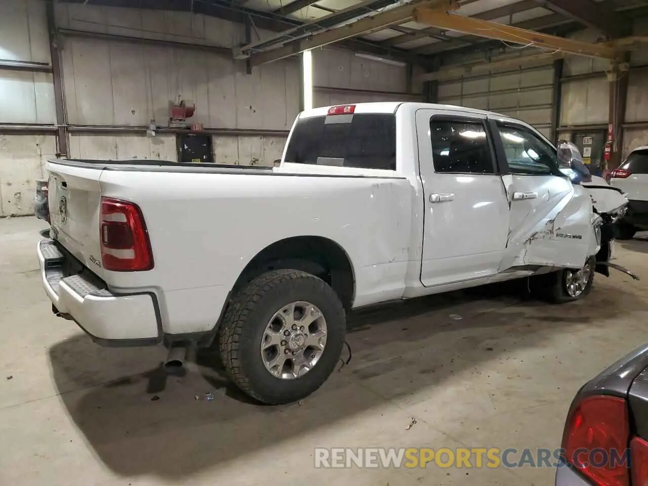 3 Photograph of a damaged car 3C6UR5FLXPG632054 RAM 2500 2023