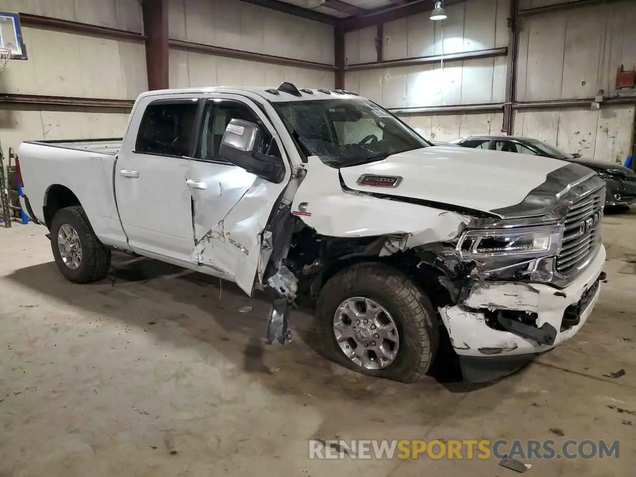 4 Photograph of a damaged car 3C6UR5FLXPG632054 RAM 2500 2023