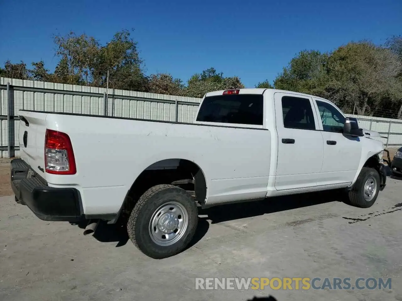 3 Photograph of a damaged car 3C6UR5HJ0PG610057 RAM 2500 2023