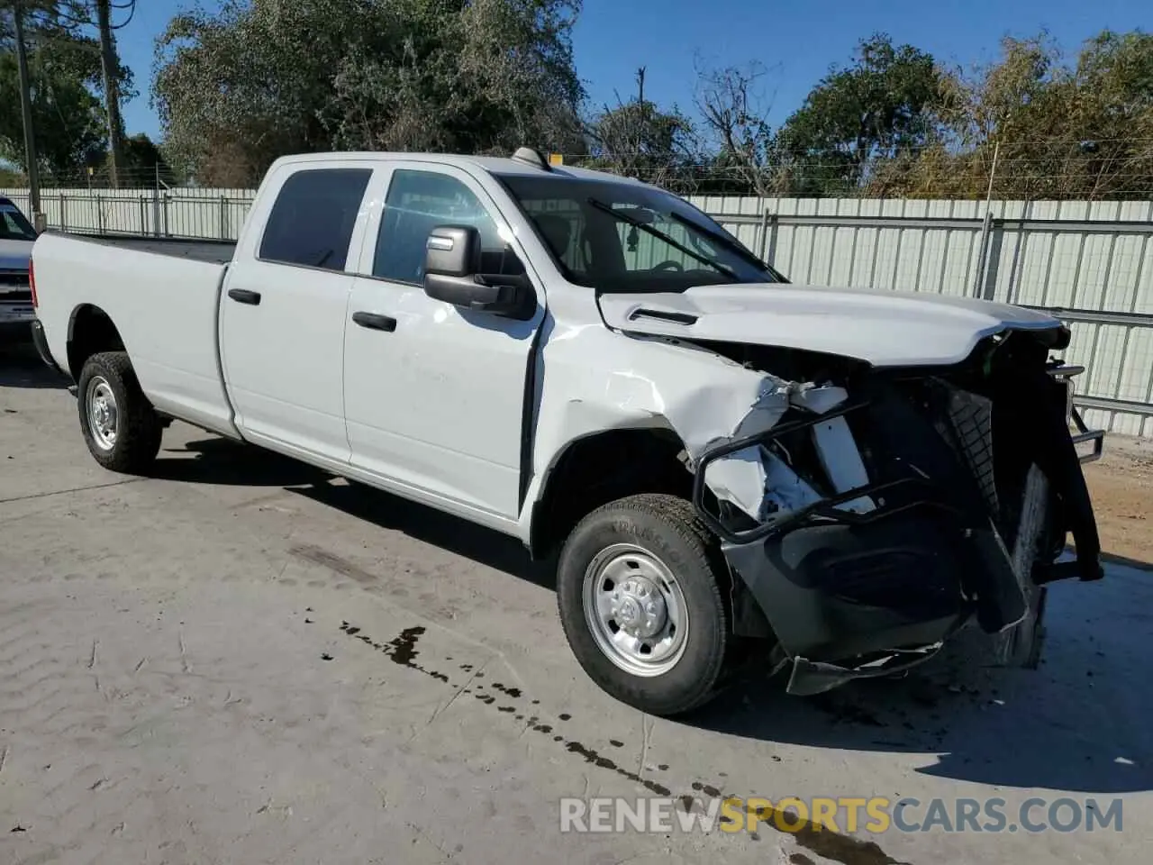 4 Photograph of a damaged car 3C6UR5HJ0PG610057 RAM 2500 2023
