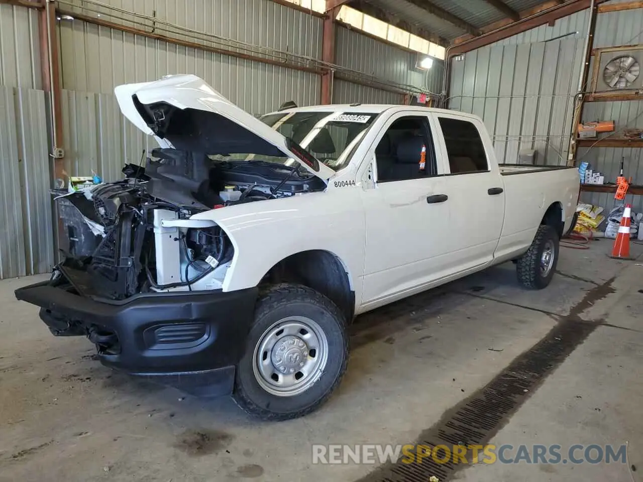 1 Photograph of a damaged car 3C6UR5HJ9PG587488 RAM 2500 2023