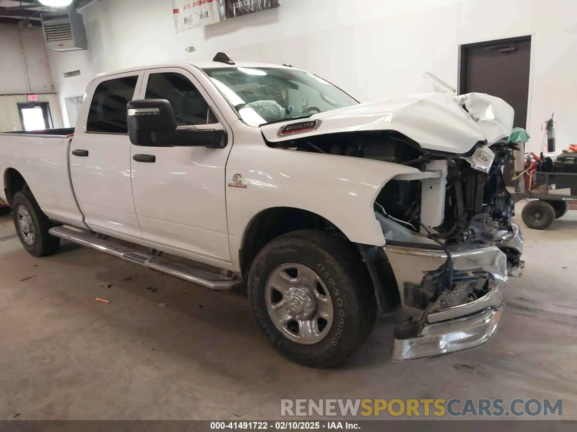 1 Photograph of a damaged car 3C6UR5HL0PG529660 RAM 2500 2023