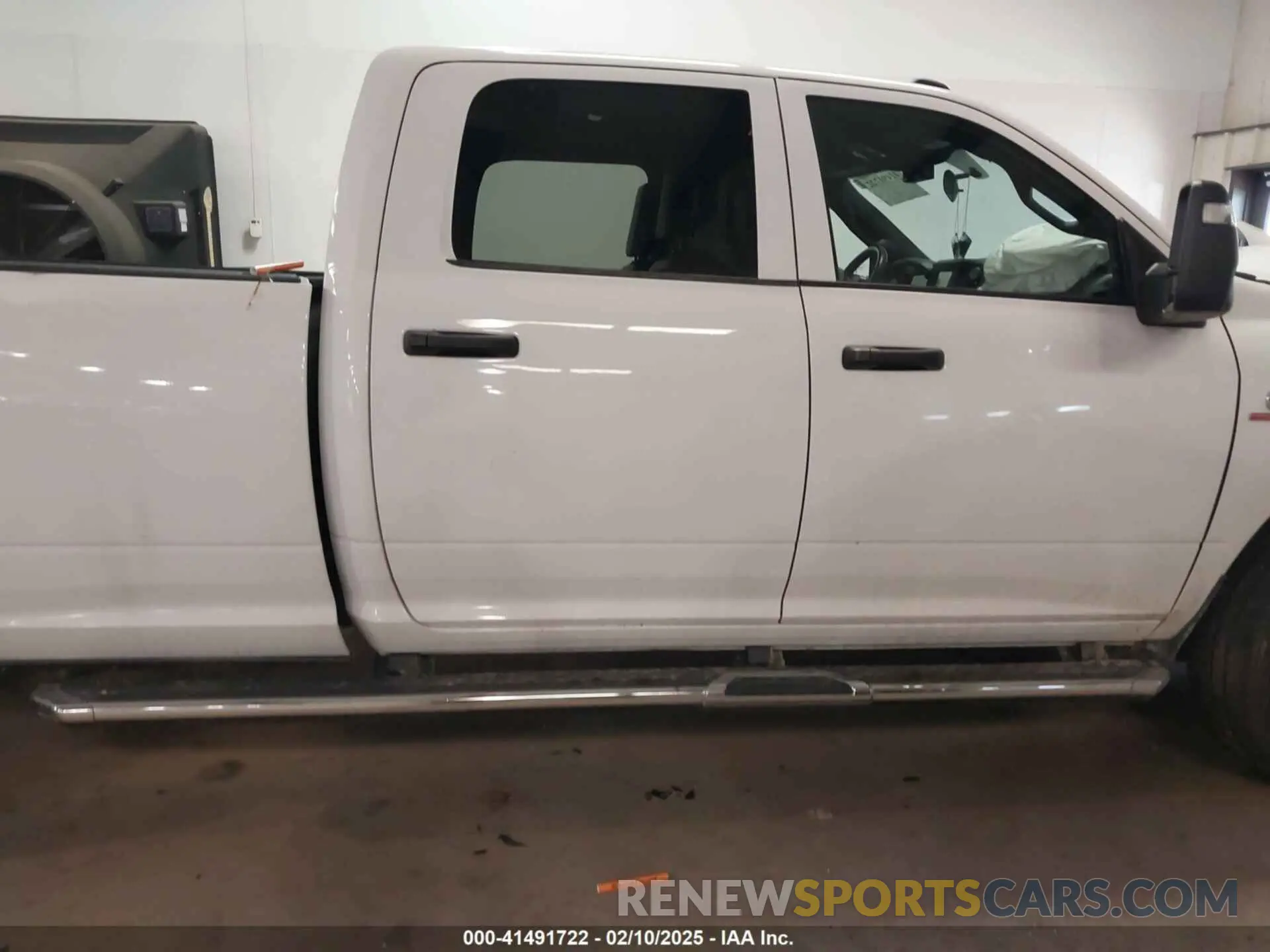 13 Photograph of a damaged car 3C6UR5HL0PG529660 RAM 2500 2023