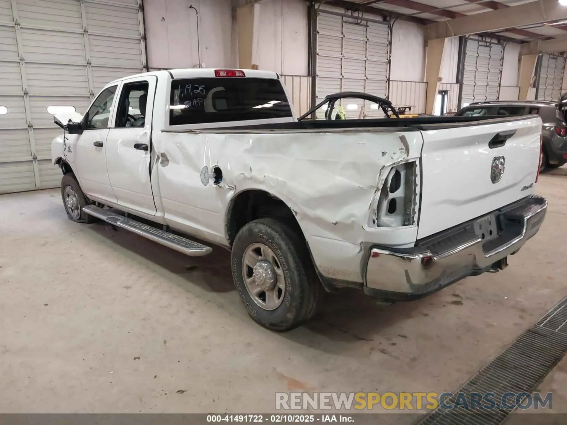 3 Photograph of a damaged car 3C6UR5HL0PG529660 RAM 2500 2023