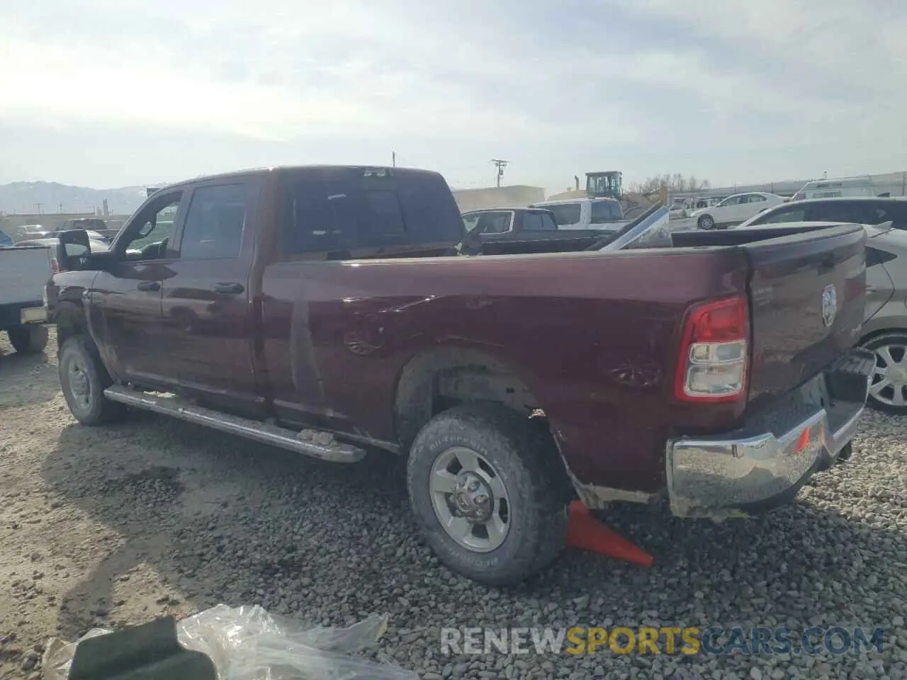 2 Photograph of a damaged car 3C6UR5HL2PG540031 RAM 2500 2023