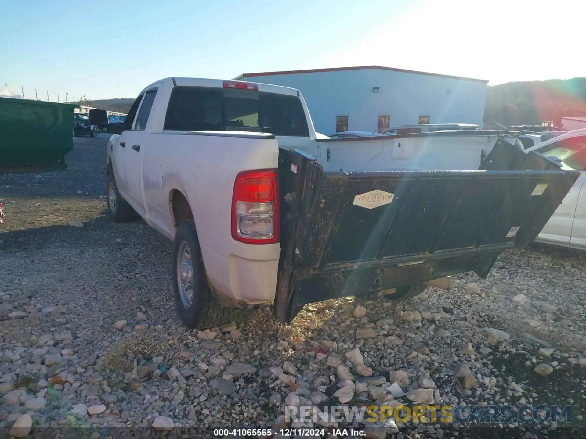 3 Photograph of a damaged car 3C6UR5HL4PG506690 RAM 2500 2023