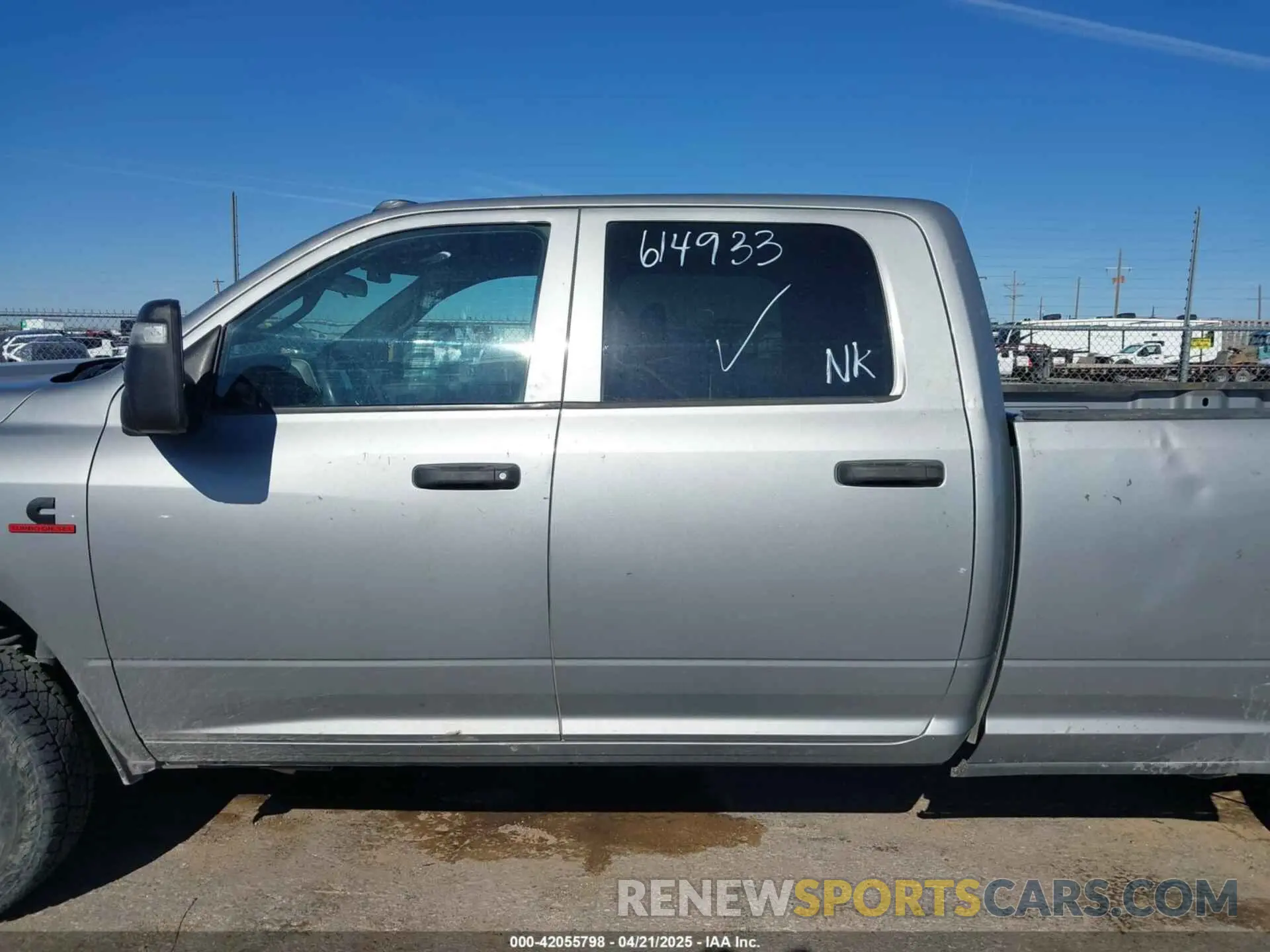 13 Photograph of a damaged car 3C6UR5HL7PG614933 RAM 2500 2023