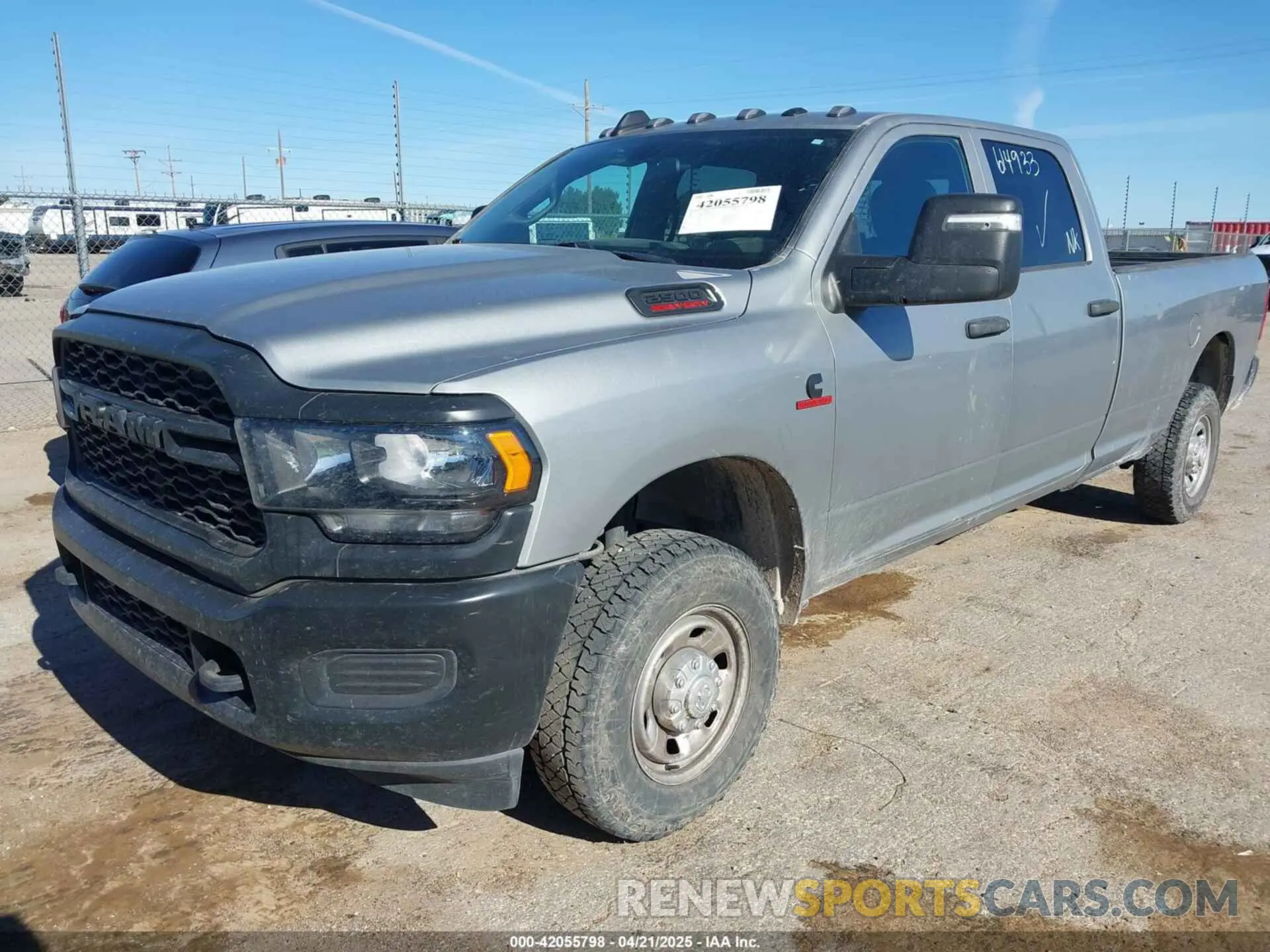 2 Photograph of a damaged car 3C6UR5HL7PG614933 RAM 2500 2023