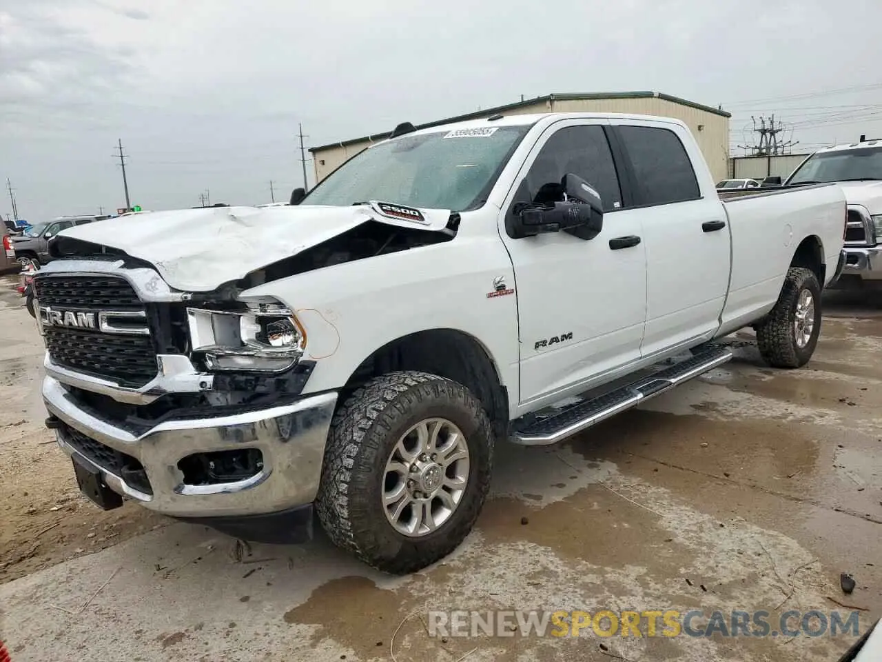 1 Photograph of a damaged car 3C6UR5JL3PG576451 RAM 2500 2023