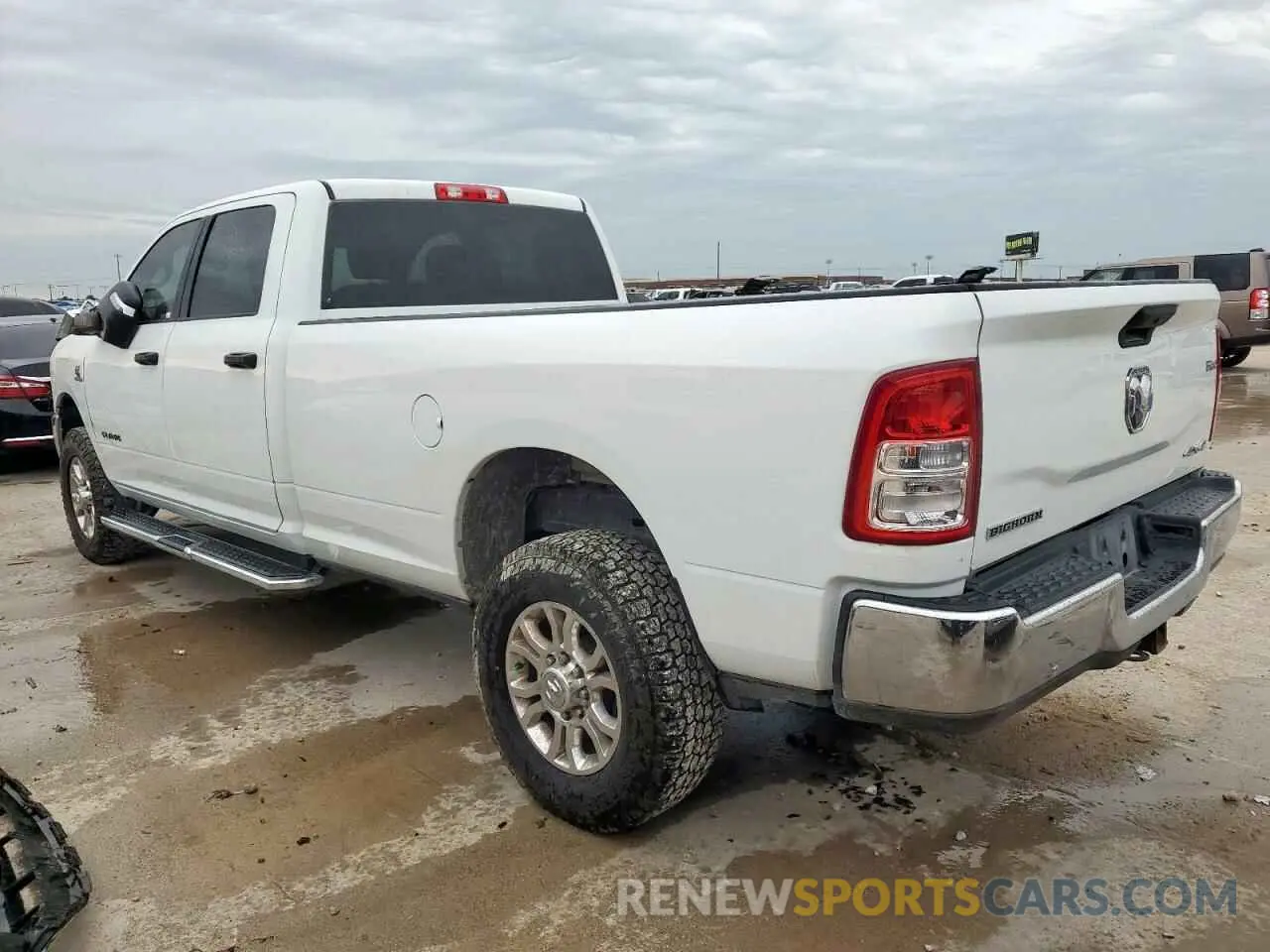 2 Photograph of a damaged car 3C6UR5JL3PG576451 RAM 2500 2023