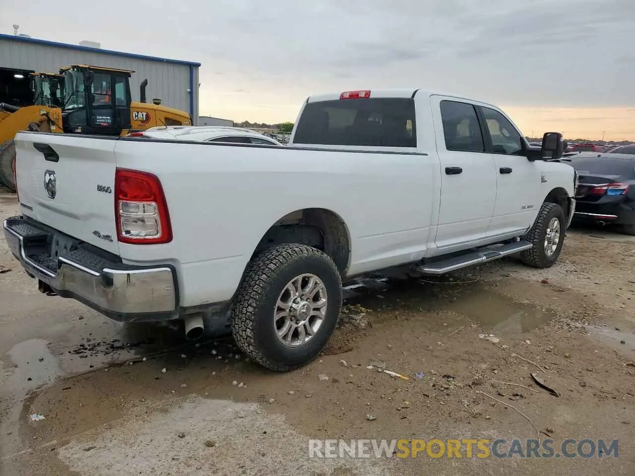 3 Photograph of a damaged car 3C6UR5JL3PG576451 RAM 2500 2023