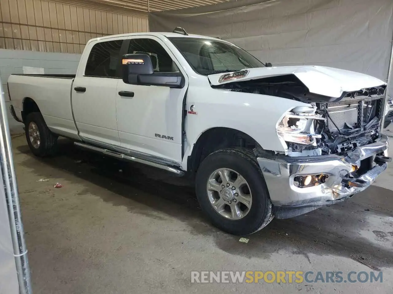 4 Photograph of a damaged car 3C6UR5JL6PG587668 RAM 2500 2023