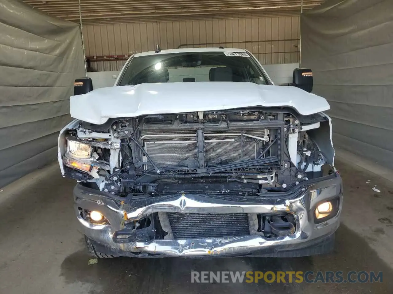5 Photograph of a damaged car 3C6UR5JL6PG587668 RAM 2500 2023