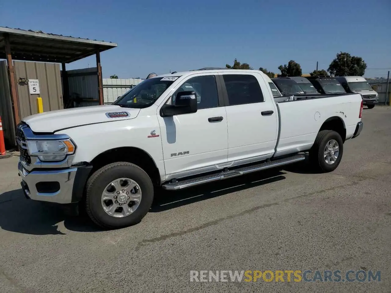 1 Photograph of a damaged car 3C6UR5JL9PG600980 RAM 2500 2023