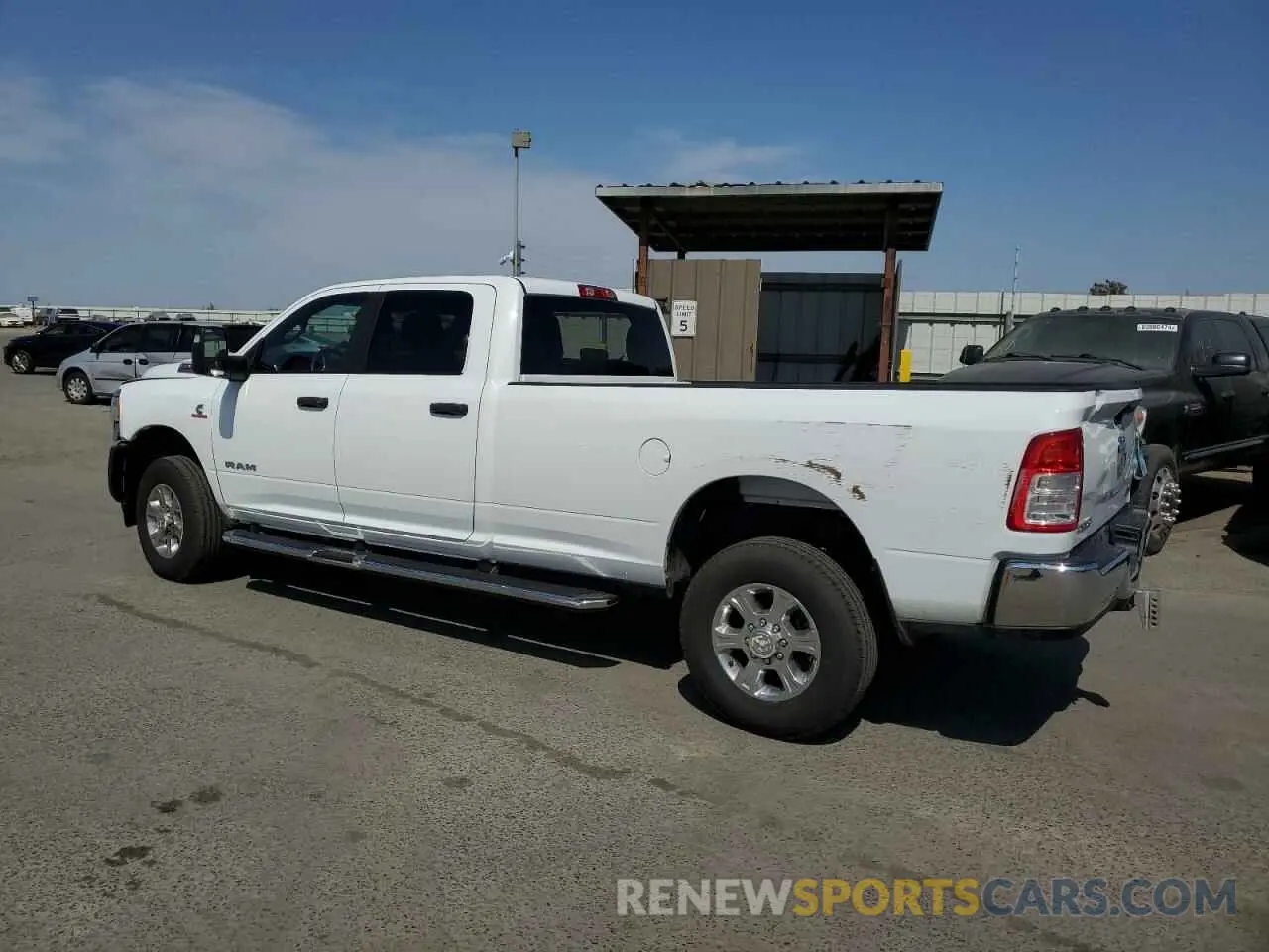 2 Photograph of a damaged car 3C6UR5JL9PG600980 RAM 2500 2023