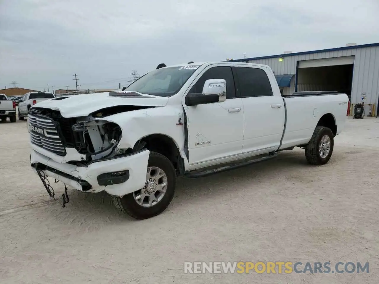 1 Photograph of a damaged car 3C6UR5KL4PG549631 RAM 2500 2023