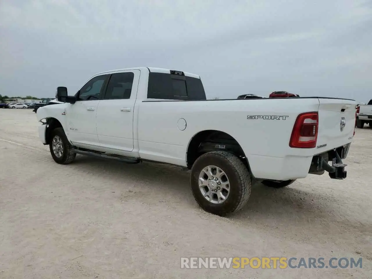 2 Photograph of a damaged car 3C6UR5KL4PG549631 RAM 2500 2023