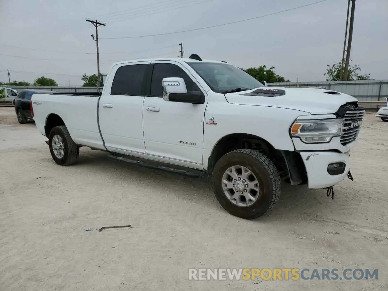 4 Photograph of a damaged car 3C6UR5KL4PG549631 RAM 2500 2023
