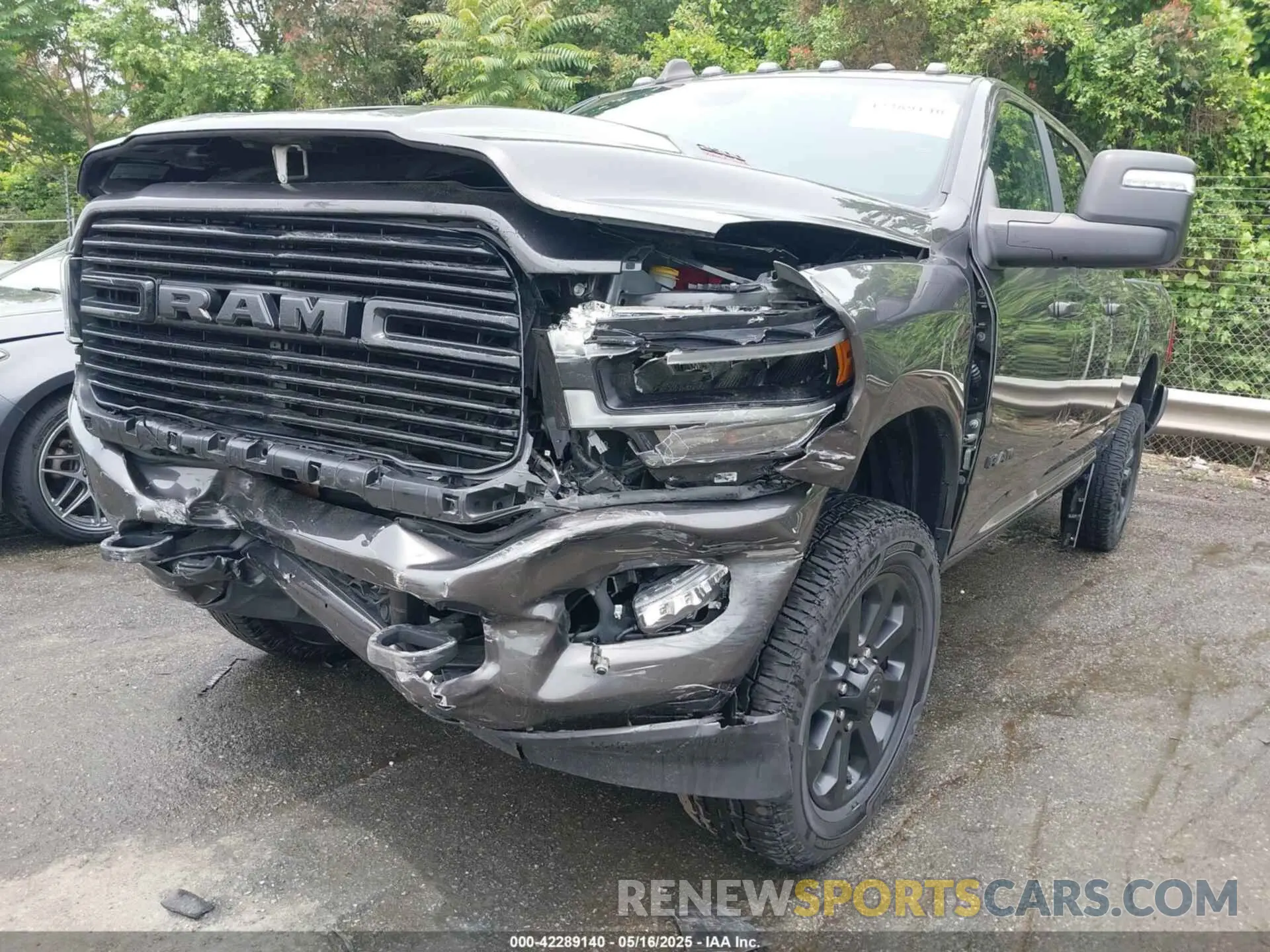 2 Photograph of a damaged car 3C6UR5NJ7PG523857 RAM 2500 2023