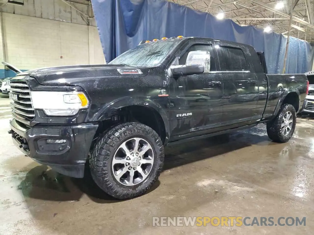 1 Photograph of a damaged car 3C6UR5PL8PG591647 RAM 2500 2023